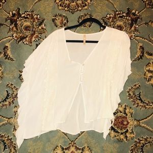Boho style white shirt with ruffle detailing